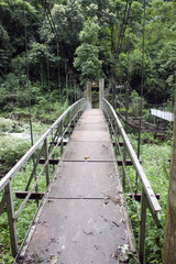 Obraz premium Bridge over a stream in Sikkim, India