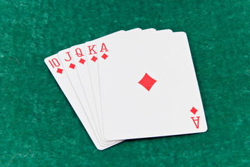 Diamond royal flush on green background