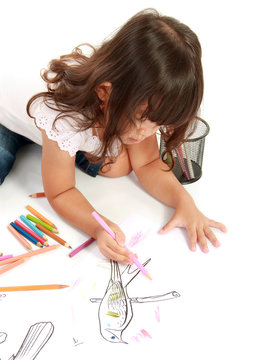 Girl coloring on paper
