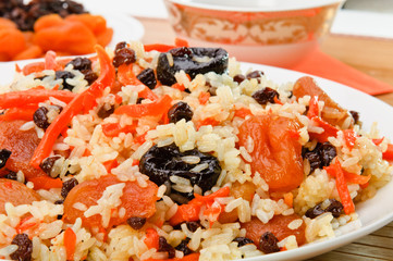 Pilaf made ​​of rice, fresh carrots and dried fruits.