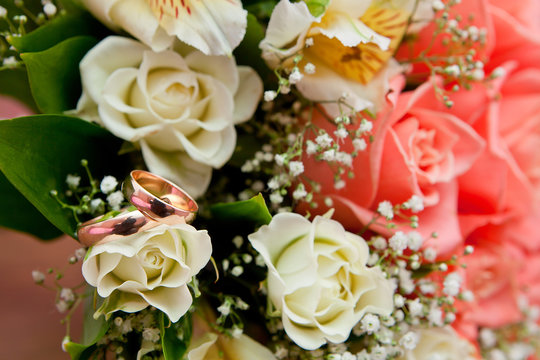Gold wedding ring on flower