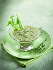 Celery cream soup with thymus on glass