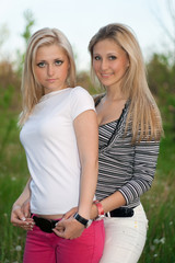 Obraz premium Portrait of two smiling attractive young women