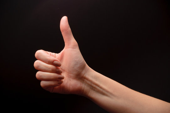 woman hand on black background