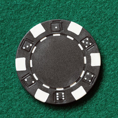 Naklejka premium black poker chip on a table