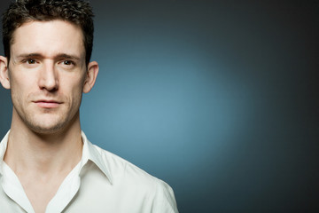 Young handsome man in white shirt.