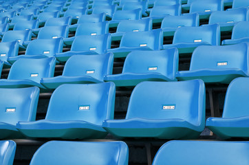 Fototapeta premium Blue Empty plastic seats at stadium