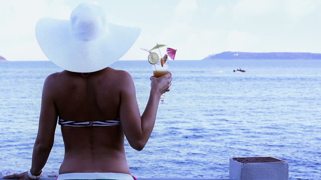 Woman on vacations with cocktail drink