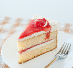 cake with cream and jelly strawberries