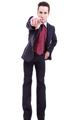 young business man in suit pointing at you