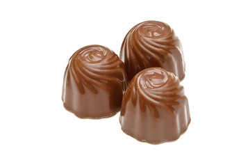 Chocolate pralines on white background