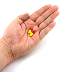 hand holding flu pills