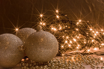 shining golden ornaments and Christmas light garland