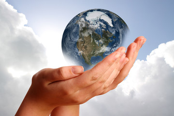 Two hands holding the earth