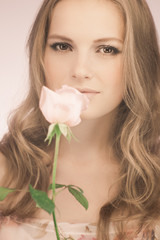 Romantic girl with pink rose
