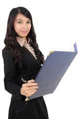 young businesswoman carrying a book and a pen isolated on white