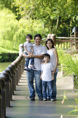 Fototapeta na wymiar asian family playing on outdoor