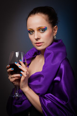 Young woman with glass of wine.