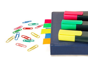 paper clips, markers, notebook with tabs