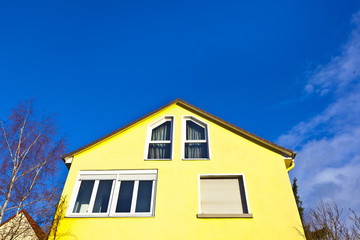 facade of house with blue sky