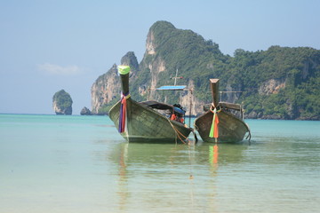 Two tied boats at Phi Phi island beach