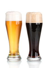 black and golden beer in glasses isolated on white