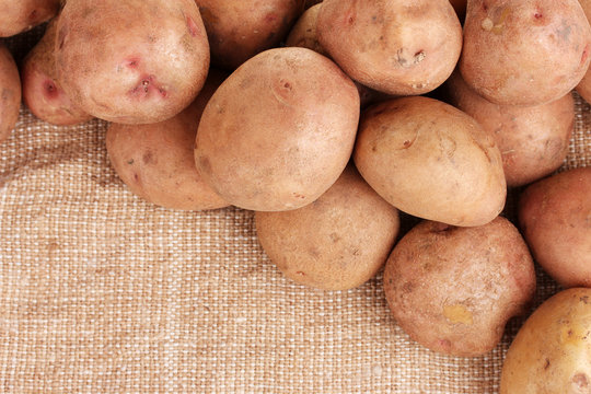 Fresh Potatoes On Burlap Closeup