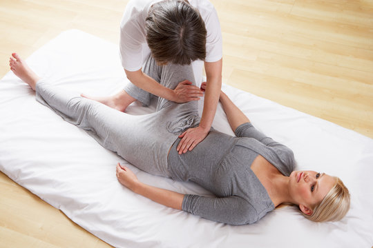Woman having Shiatsu massage