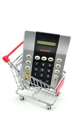 Financial concept of a calculator in a shopping trolley cart.