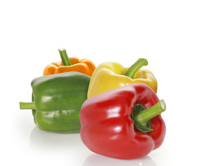 red green & yellow pepper on the white background