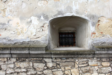 Vintage stone wall with a window