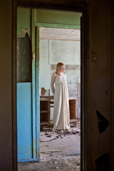 Woman in abandoned house