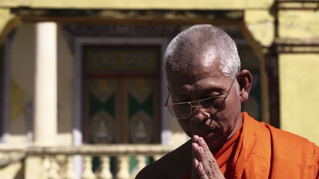 Portrait of old buddhist monk in monastery, Cambodia, Asia