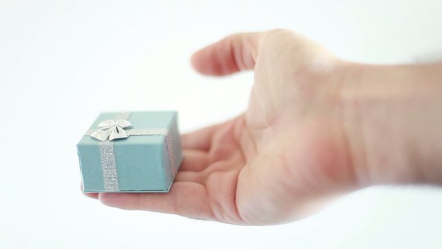 Hand giving a gift
