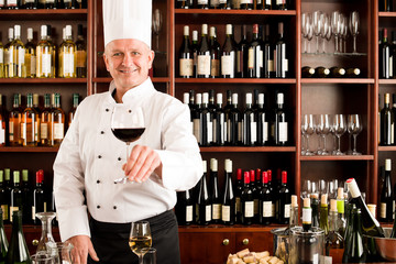 Chef cook smiling serve wine glass restaurant