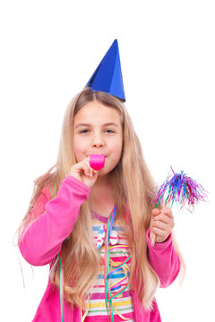 girl with party hat and party horn blower