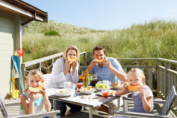 Family on vacation eating outdoors