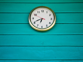 White clock on Green wall