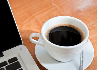 laptop and a cup of coffee