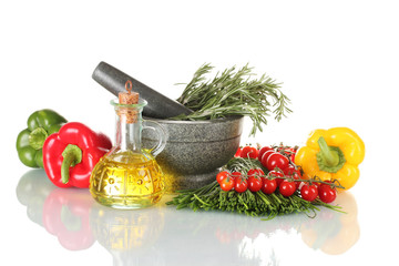rosemary in mortar, oil in jar, paprika, tomatoes cherry, and