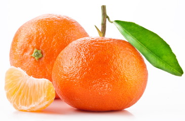 Tangerines with leaves on white background.