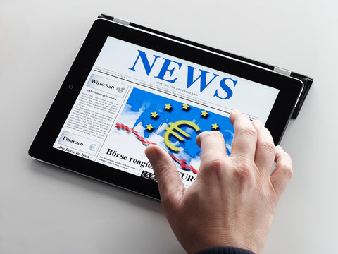 Reading business news on tablet PC