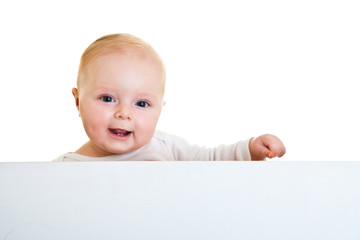 Isolated beaufiful caucasian infant baby behind whiteboard