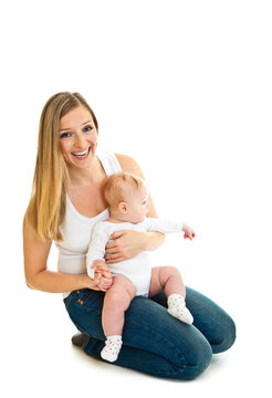 Mother with happy and cute infant baby girl isolated on white