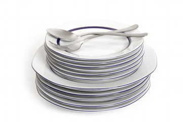 A stack of plate, knife and fork