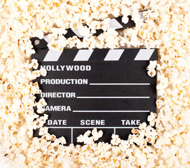movie clapper board with popcorn