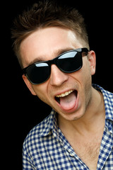 cheerful guy on dark glasses