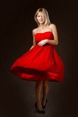 beautiful blonde girl in a red dress