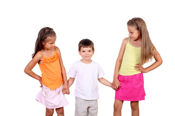 Fototapeta premium Two girls and a boy together in studio