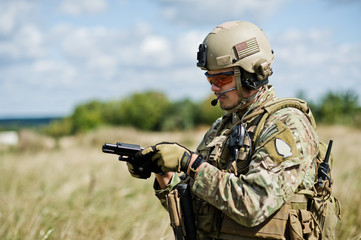 Fototapeta premium A soldier with a gun